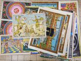 a pile of art on the floor of a tiled floor