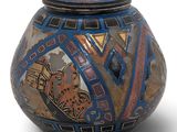 an image of a vase with a picture of a cat on it