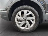 a close up view of a car ' s tire on the pavement
