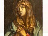 a painting of a woman with a veil on her head