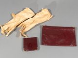 a pair of gloves and a wallet on a table