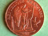 an image of a penny with a statue on it on a green surface