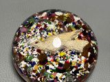 a picture of a donut with sprinkles on it