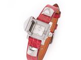 a close up of a wrist watch with a red leather band