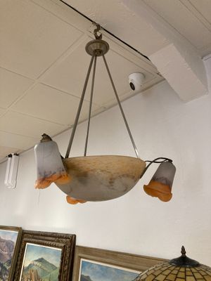 a light hanging from the ceiling in a room