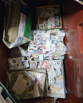 a box full of mail sitting on the floor