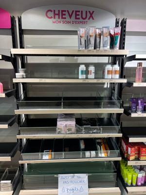 many shelves of cosmetics products in the store