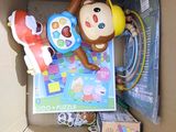 a box with toys in it and a stuffed animal in it