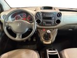 the interior of a small car with a steering wheel and dashboard controls