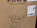 cardboard box with a drawing of a baby in a high chair