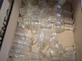 a box full of empty empty glass bottles in it