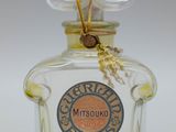 an image of a bottle of cologne sitting on top of a table