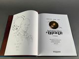 an open book with a drawing of a man on it
