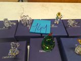 a lot of glass figurines sitting on a table