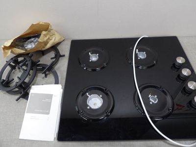 an image of a black stove top with four burners