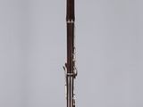 an old flute with a wooden handle on a clear stand