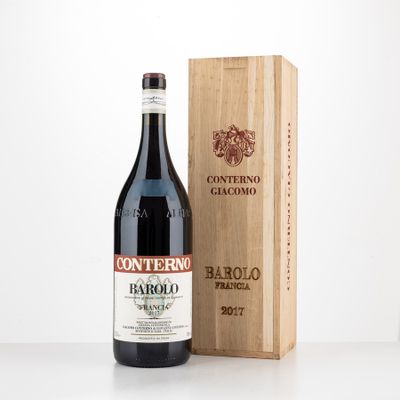 a bottle of wine sitting next to a wooden box