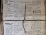 an old french newspaper sitting on top of a wooden table