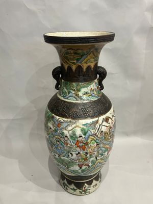 a vase that is sitting on a white surface