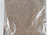 a bag of brown fabric on a white surface