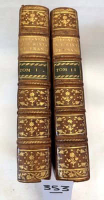 a set of four books sitting on top of each other