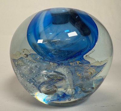 a glass ball with a blue and white design on it