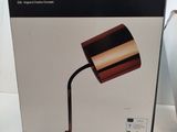 packaging for a lamp that is sitting on top of a table