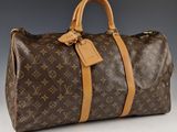 Sac Keepall Louis Vuitton en toile Monogram et cuir