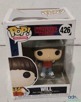 a close up of a pop vinyl figure in a box