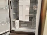 an open refrigerator with the door open in a room