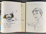 an open book with drawings of people and animals on it