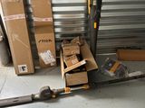 many boxes and a pair of scissors sitting on the floor