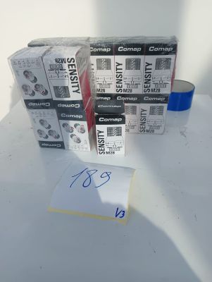 many boxes of toilet paper on a table with a note