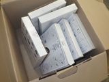 a cardboard box with a bunch of electronic equipment inside of it