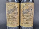 two bottles of wine sitting next to each other on top of a table