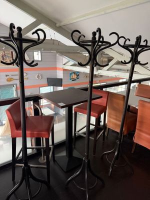 three stools sitting at a table in a restaurant