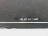 a picture of a black book with white writing on it