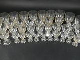 a close up of a bunch of wine glasses on a table