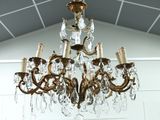 a chandelier hanging from the ceiling in a room