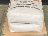 a large bag of cement on a pallet in front of a building