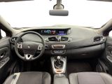 the interior of a car with a steering wheel, dashboard, and dashboard controls
