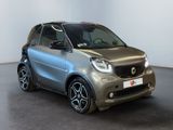 the smart car is parked in a room with a white wall