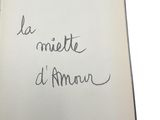 an open book with a handwritten phrase on it