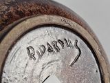a close up of a clock with the word ridarius written on it