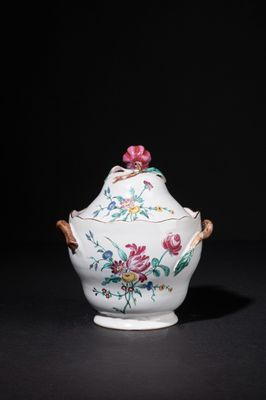 an image of a white and pink vase with flowers on it