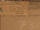 a brown box with a piece of paper on top of it