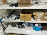 many boxes and containers on the shelves in the room