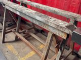 an image of a bench made of wood in a workshop