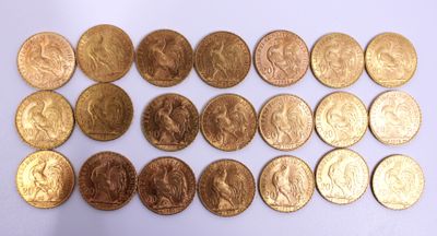a lot of gold coins on a white surface