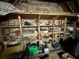 a room that has a bunch of items on the shelves